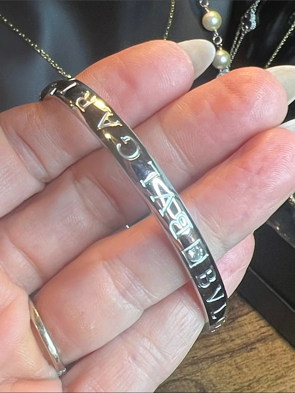 Polished Silver-Tone Stainless Steel Logo Bangle Bracelet with Crystal Accent